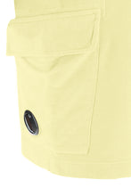 Load image into Gallery viewer, Cp Company Resist Dyed Lens Fleece Shorts In Pastel Yellow
