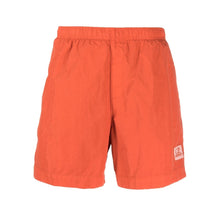 Load image into Gallery viewer, CP Company Flatt Nylon Stitch Logo Swim Shorts in Pumpkin Orange
